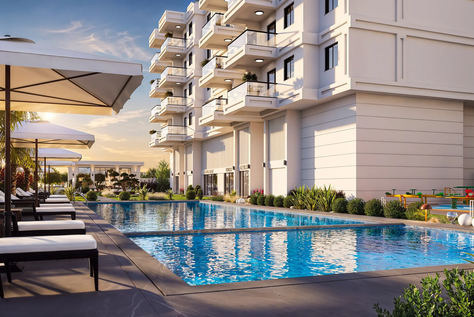 Karat Alyans açık yüzme havuzu ve blok cepheleri gün batımı ışığında